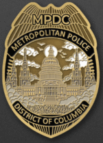 MPDC Halloween 2025 challenge coin front with authentic Metropolitan Police badge, Capitol building, and District of Columbia text in antique gold
