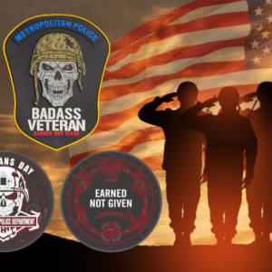 Veterans Day 2025 MPDC Badass Veteran PVC patch collection with glow-in-the-dark text featuring tactical skull design and American flag background with saluting soldiers silhouette