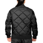 Woman wearing a navy blue 1221-JW Bravest Ladies Fit Quilted Jacket with ribbed collar and cuffs, designed for female first responders.