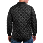 Man wearing a navy blue 1250 Icon Quilted Jacket with ribbed collar and cuffs, designed for male first responders and uniformed professionals.
