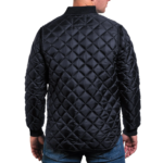 Man wearing a navy blue 1250 Icon Quilted Jacket with ribbed collar and cuffs, designed for male first responders and uniformed professionals.