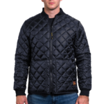 Man wearing a navy blue 1250 Icon Quilted Jacket with ribbed collar and cuffs, designed for male first responders and uniformed professionals.