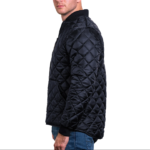 Man wearing a navy blue 1250 Icon Quilted Jacket with ribbed collar and cuffs, designed for male first responders and uniformed professionals.