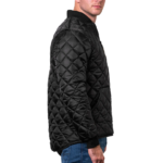 Man wearing a navy blue 1250 Icon Quilted Jacket with ribbed collar and cuffs, designed for male first responders and uniformed professionals.