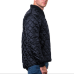 Man wearing a navy blue 1250 Icon Quilted Jacket with ribbed collar and cuffs, designed for male first responders and uniformed professionals.
