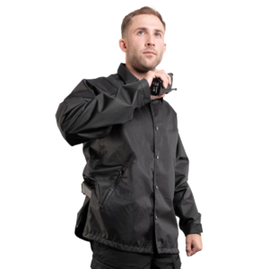 Man wearing a navy 411 Tactical Raid Jacket with snap-front closure and collared design, lightweight duty outerwear for law enforcement and first responders.