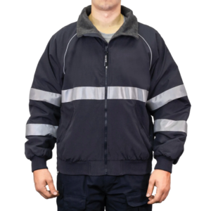 Man wearing a navy 9450 Commander Bomber Jacket with reflective stripes on chest and sleeves, fleece collar, and ribbed cuffs—designed for first responders.